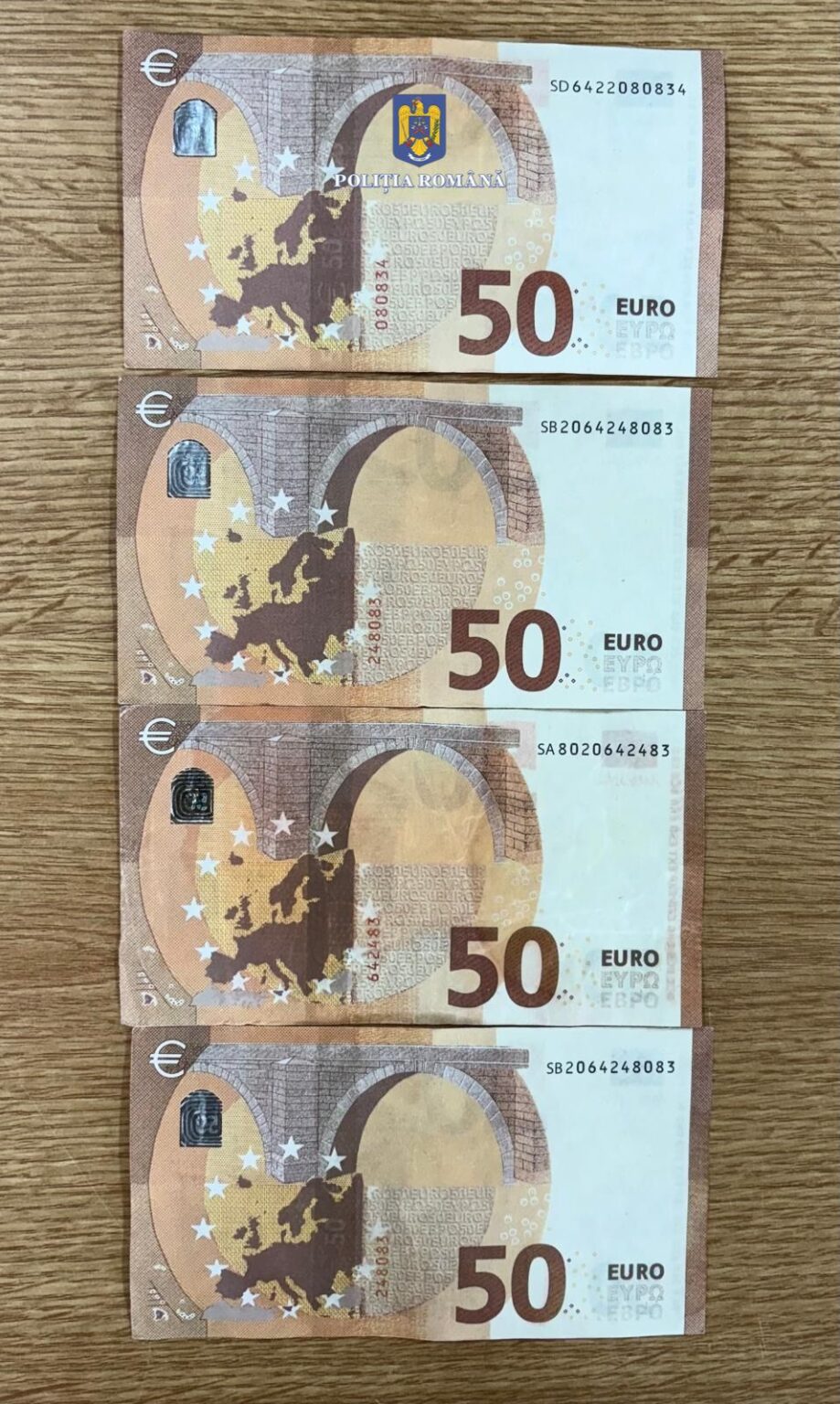 Percheziții și rețineri la Târgoviște: Trei persoane au pus  în circulație bani falși 